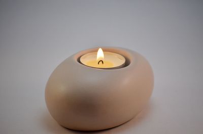 Close-up of tea light candle on table