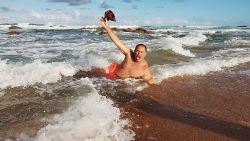 Man swimming in sea at beach