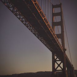 Low angle view of bridge against sky at night