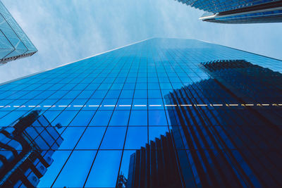 Low angle view of modern buildings against sky