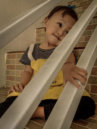 Boy looking at camera at home