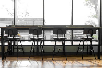 Empty chairs and tables in restaurant