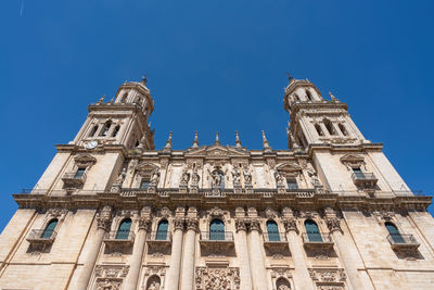 Low angle view of historic building against clear blue sky