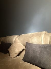 Close-up of sofa on table against white background
