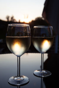Close-up of wine glasses on table