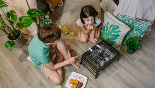 Kids doing barbecue at home