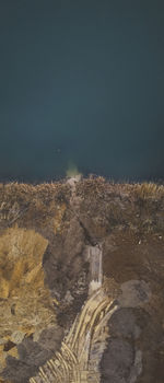 Aerial view of rocks on land against sky at night