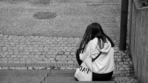 Rear view of girl standing outdoors