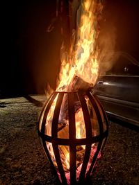 Close-up of fire burning at night