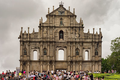 Group of people in front of historical building