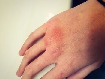 Close-up of hands against white background