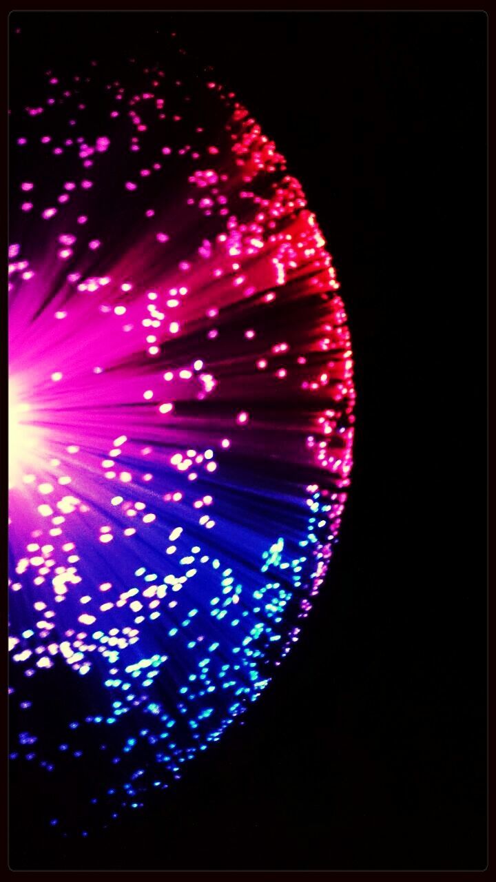 night, illuminated, multi colored, glowing, pattern, celebration, low angle view, arts culture and entertainment, circle, lighting equipment, decoration, blue, no people, light - natural phenomenon, abstract, design, light, outdoors, purple, dark