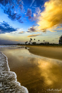 Scenic view of beach against sky during sunset