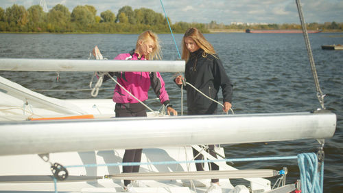 People on boat against sea