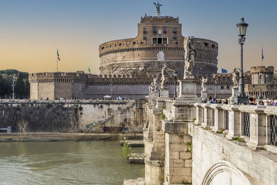 Tevere river and castle sant'angelo in rome at sunset