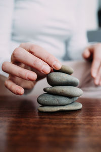 A woman collects a cairn, the concept of calmness and meditation.