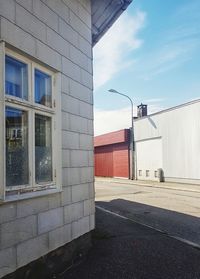 Street by building against sky