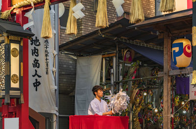 Man standing at market stall