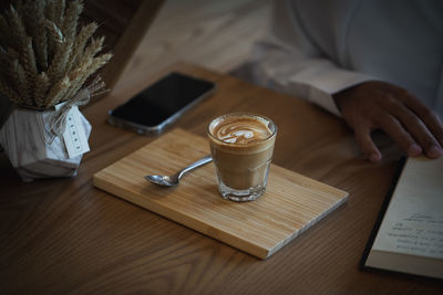 High angle view of coffee cup on table