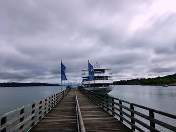 Pier over sea against sky