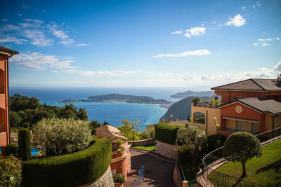 Panoramic shot of buildings by sea against sky