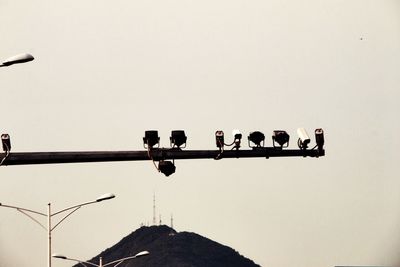 Low angle view of lamp post against clear sky