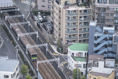 High angle view of street amidst buildings in city