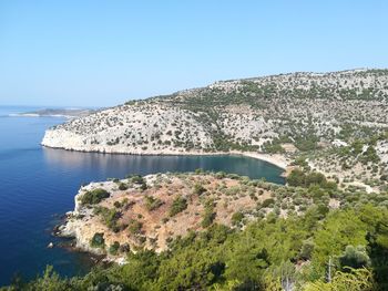 Scenic view of sea against clear blue sky