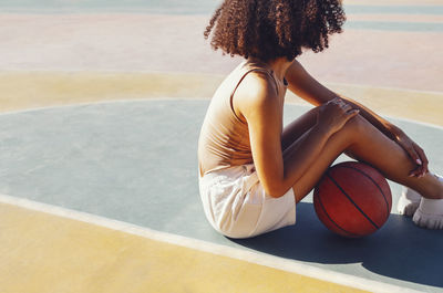 Young woman playing basketball