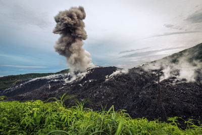 View of volcanic landscape against sky