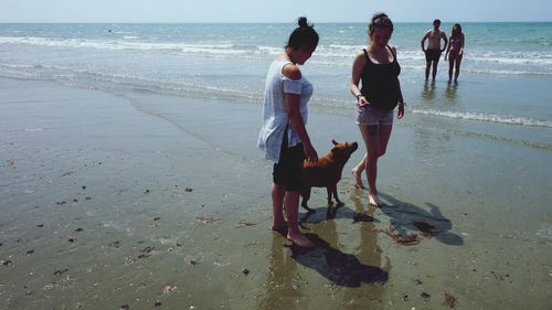 People walking on beach