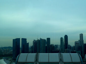 Modern buildings in city against sky