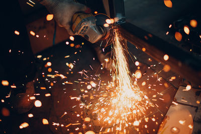 Close-up of person welding metal