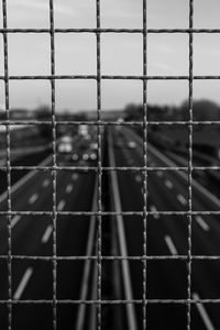 Full frame shot of soccer field seen through chainlink fence