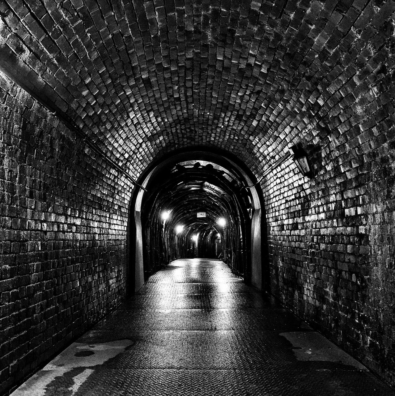 the way forward, direction, architecture, tunnel, arch, illuminated, diminishing perspective, lighting equipment, indoors, built structure, wall - building feature, wall, empty, brick wall, no people, brick, ceiling, vanishing point, footpath, light at the end of the tunnel, light, underpass, underground walkway, long