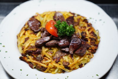 Close-up of noodles served in plate on table