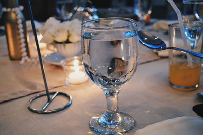 Close-up of wine glasses on table