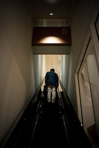 Woman standing in tunnel