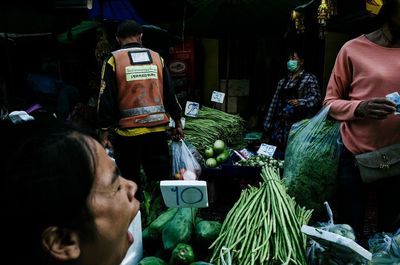 People at market stall