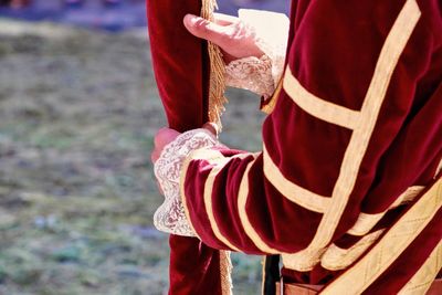Midsection of person wearing velvet costume