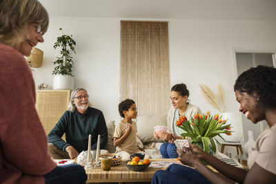 Family playing cards at home