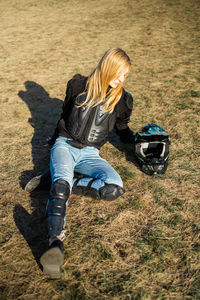 Woman motocross rider resting