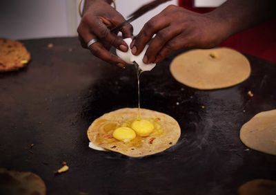 Close-up of man preparing food