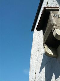 Low angle view of built structure against blue sky