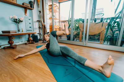 Low section of woman exercising in gym