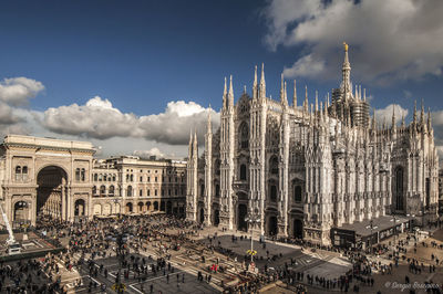 Panoramic view of milan cathedral against cloudy sky