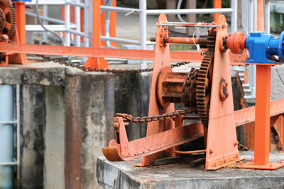 Orange rusty machine part at factory