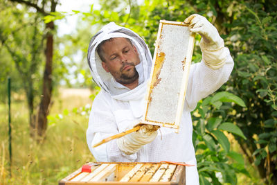 Beekeeper working in park