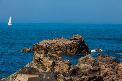 Scenic view of sea against clear blue sky