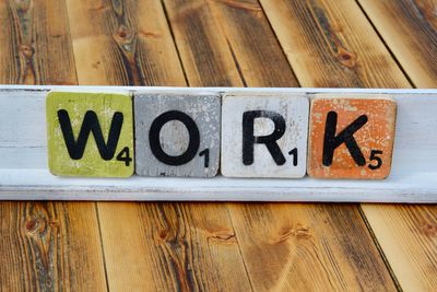 High angle view of text blocks on wooden table